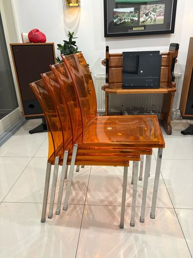 Four striking chrome and plastic orange vintage Italian dining chairs. Very decent and useable condition. A bargain at this price.