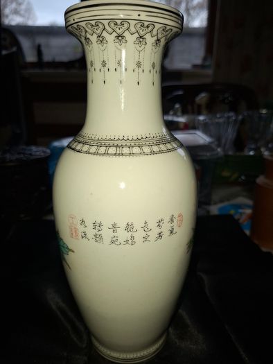 Chinese porcelain vase from the Jingdezhen region featuring a hand painted peacock and floral motif., Postage Available