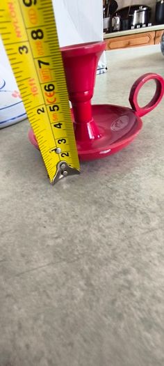 3 different itmes- 1- pottery modern design handmade candle holder 18.00 euro. 2-  red enamel candlestick holder and drip tray featuring a Considered by Helen James 12.00 euro. 3-  PAPERWEIGHT 15.00 euro