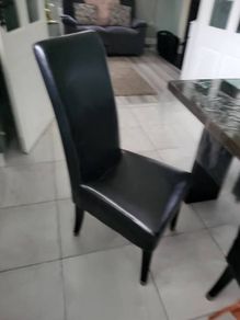 4 black leather chairs