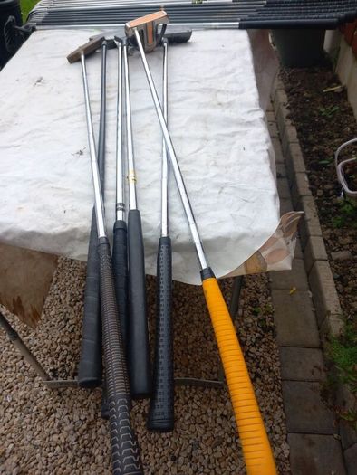 A selection of Golf clubs. Bags and golf balls.