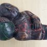 A large wooden statue of a sleeping Buddha Image 9