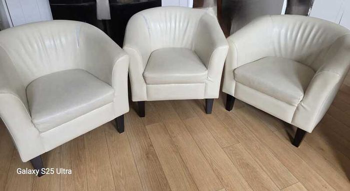 Three stylish leather arm chairs. Two require upholstery