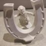 Rare find Cherub  Porcelain Horseshoe as flower vase held with child . Image 8