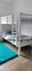 single wooden bunk bed. White