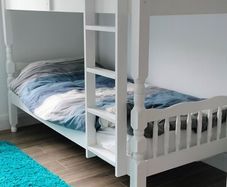 single wooden bunk bed. White