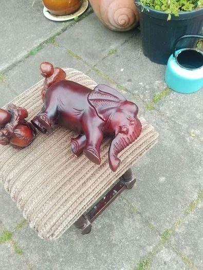 carved wooden elephant and 2 Buddha