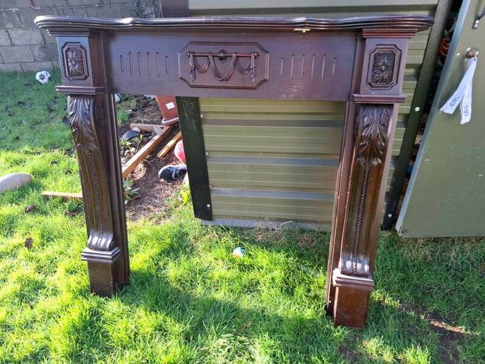 Cast iron fire inset and mahogany fireplace