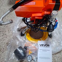 Airless paint sprayer with high pressure hose.