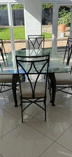 Glass dining table and 6 chairs (need gone today)