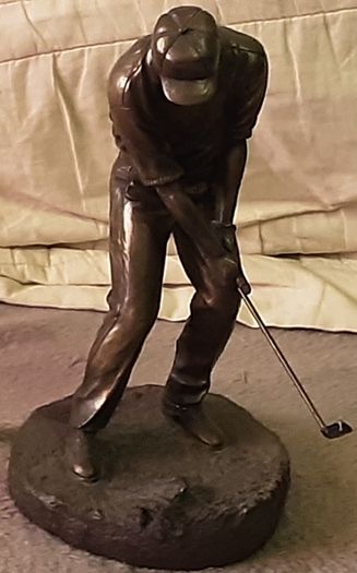 male golfing figure
