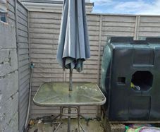 Glass table with parasol