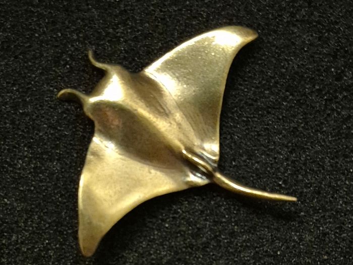 3 brass fish.