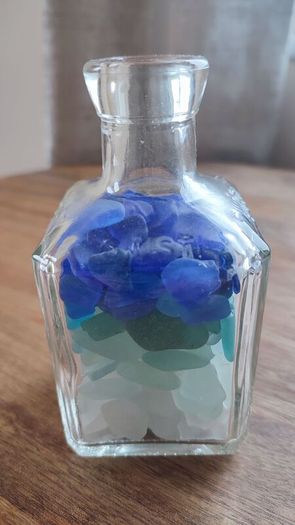 square bottle with sea glasses