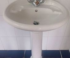 Bathroom pedestal sink and taps
