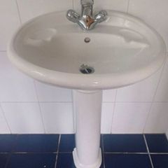 Bathroom pedestal sink and taps