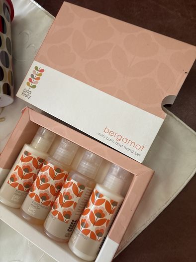A Bundle of Orla Kiely Products - Bergamot Mini bath and hand set , a pull string wash bag, 2 empty body lotion and conditioner and a limited edition travel porcelain cup for Kenco