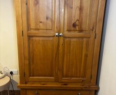 wardrobe with double hanging rails. 2 bottom drawers, 58cms deep and 106cms wide at the widest part.