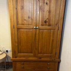 wardrobe with double hanging rails. 2 bottom drawers, 58cms deep and 106cms wide at the widest part.