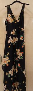 Long black summer dress with floral design.