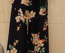 Long black summer dress with floral design.