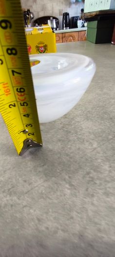 A Small Kosta Boda Art Glass Bowl with White Swirl Detail