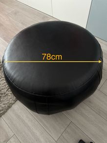 Black leather pouffe