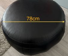 Black leather pouffe