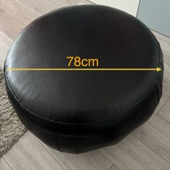 Black leather pouffe