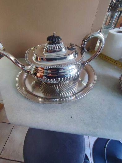 Vintage from the 19th century. Antique Period English Tea Service inc Teapot, Sugar bowl & milk jug Sheffield England on small silver plated tray.