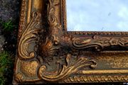 Vintage ornate gold mirror