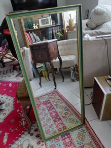 Vintage wall mirror in a green gold trimmed frame 1950s