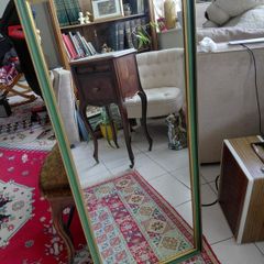 Vintage wall mirror in a green gold trimmed frame 1950s