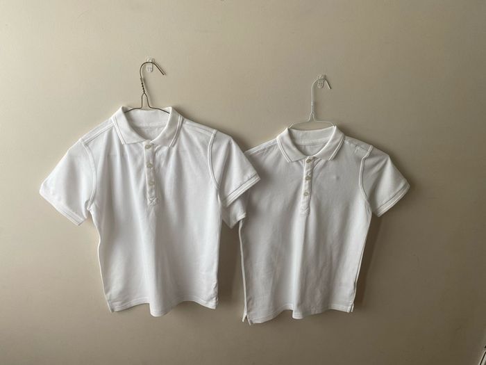 2 dunnes white polo shirts (as new) age 9-10