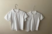 2 dunnes white polo shirts (as new) age 9-10