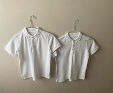 2 dunnes white polo shirts (as new) age 9-10