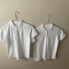 2 dunnes white polo shirts (as new) age 9-10
