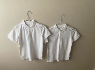 2 dunnes white polo shirts (as new) age 9-10