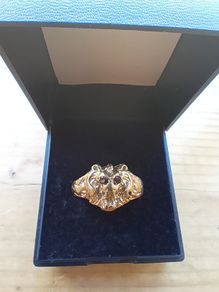 Gold lions head ring