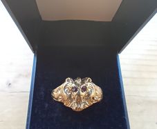 Gold lions head ring
