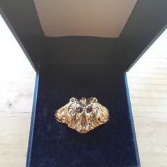 Gold lions head ring