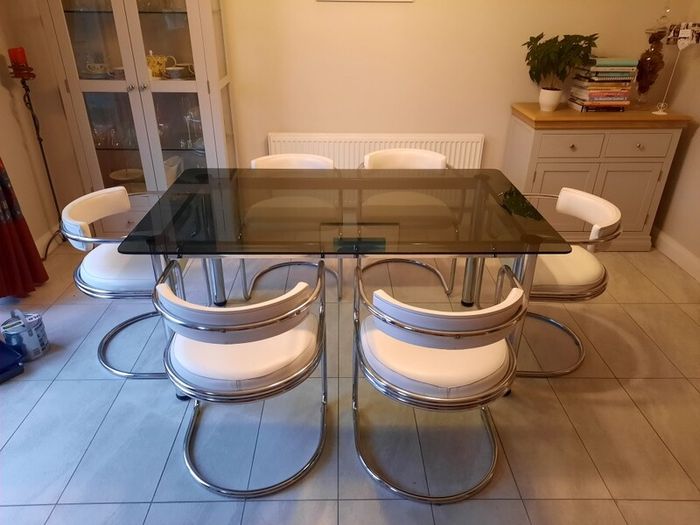 Table and 6 white leather chairs