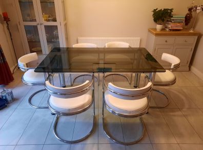 Table and 6 white leather chairs