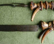 Vintage late 19th century Scottish novelty antler handled knife and fork , modelled as a deer with a face and brass tail, with a steel blade