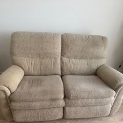reclining beige sofa