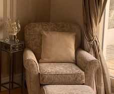 Large Cream Armchair and Footrest