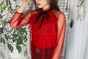 Lace blouse with a bow at the neck