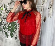 Lace blouse with a bow at the neck