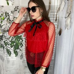Lace blouse with a bow at the neck