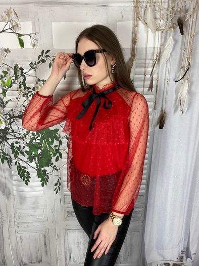 Lace blouse with a bow at the neck